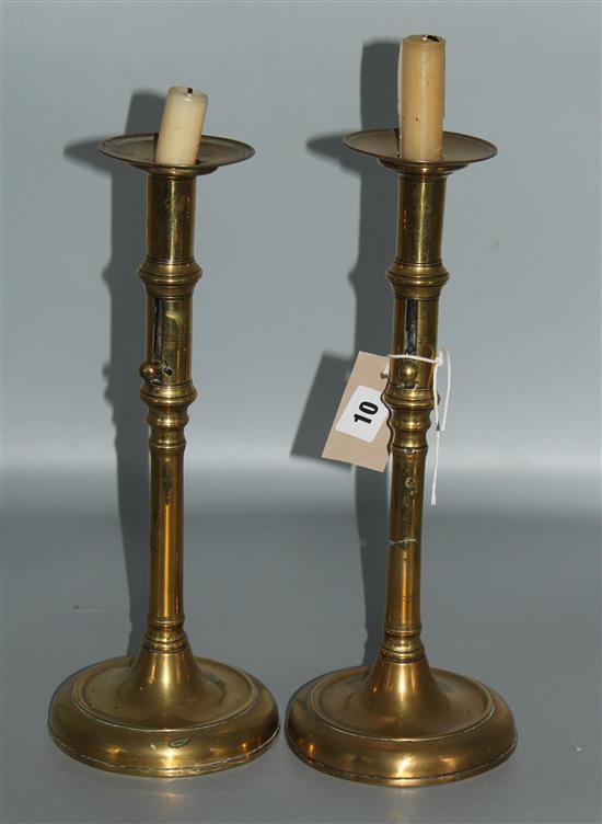 Pair of brass ejector candlesticks, circa 1700